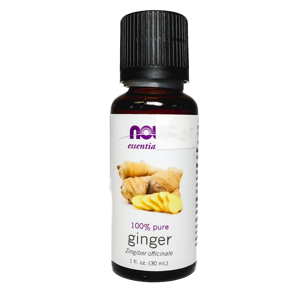 Bottle of ginger essential oil with black cap and yellow ginger root label on a white background
