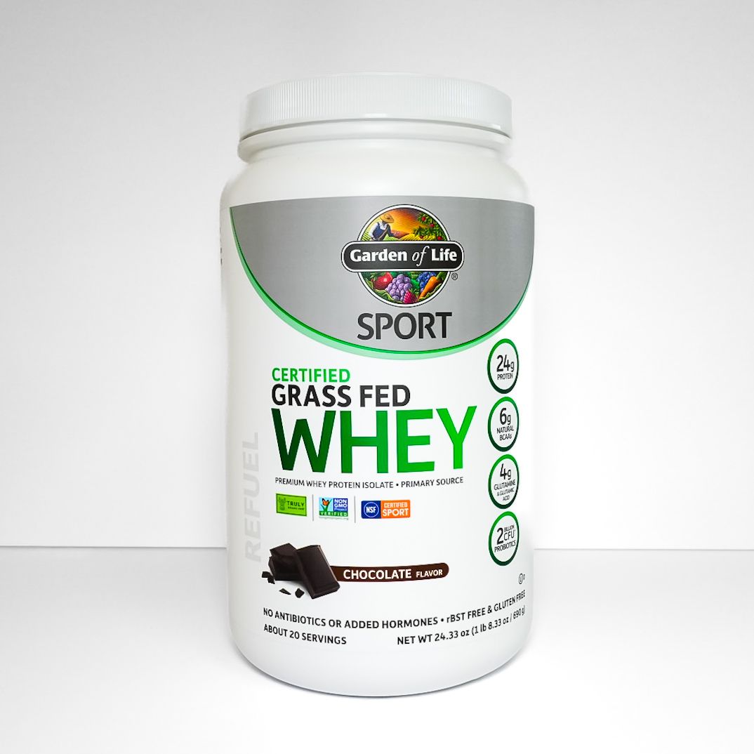 White Sports whey protein supplement jar with green label and black cap