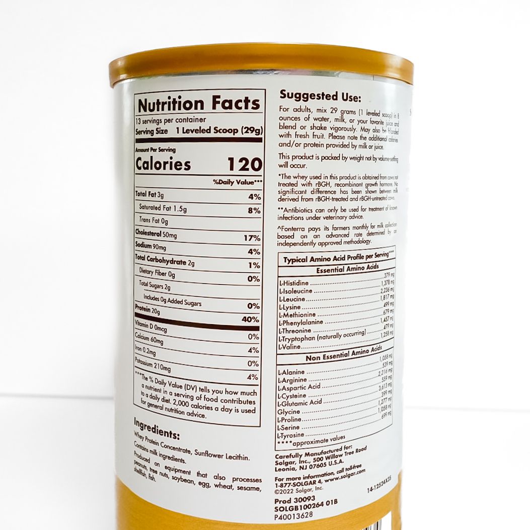 Yellow can of grass-fed whey protein with white label and gold lid.