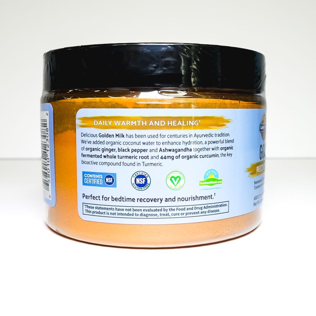 Gold Organics Golden Milk Turmeric powder jar with black lid on white background