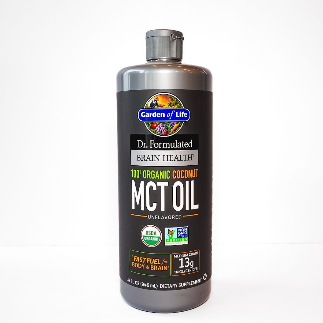 Bottle of Garden of Life organic MCT oil with dark brown label and gray cap