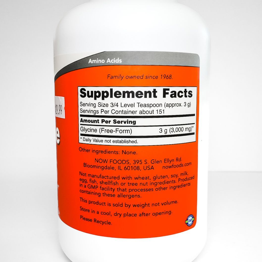 White bottle of NOW Glycine pure powder with orange label and purple cap