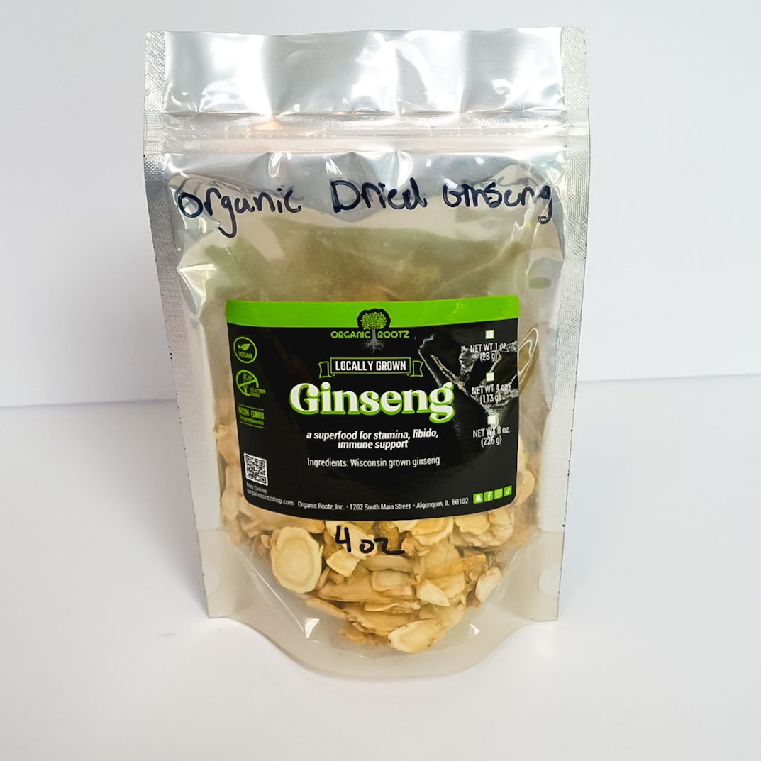 Clear bag of organic dried ginseng slices with a green label on a white background