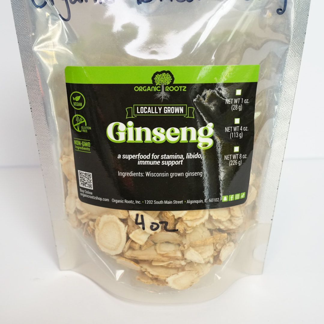 Clear resealable pouch of organic dried ginseng slices with green-and-black label on a white background