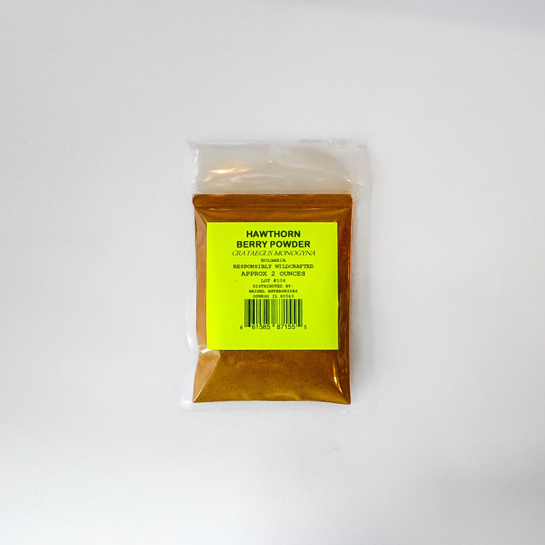 Small clear plastic packet of amber powder with a bright yellow label on a white background