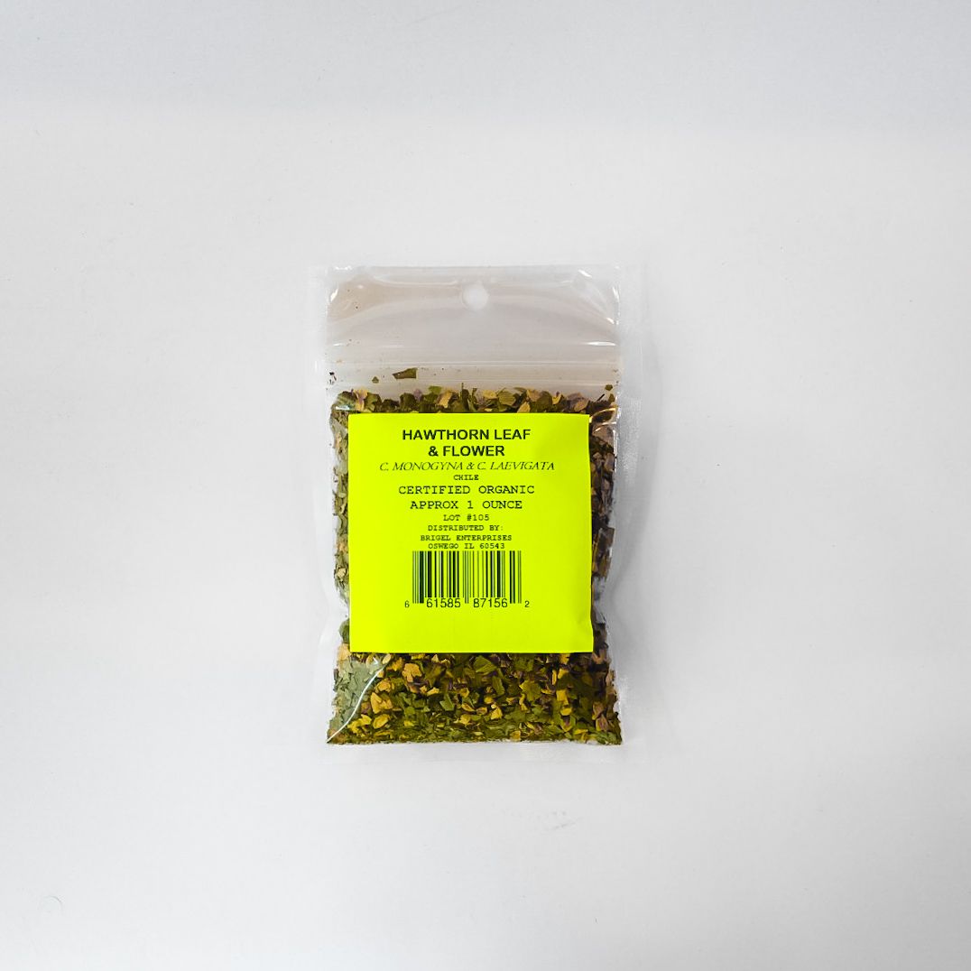 Small clear plastic bag of dried herbs with a bright yellow label on a white background