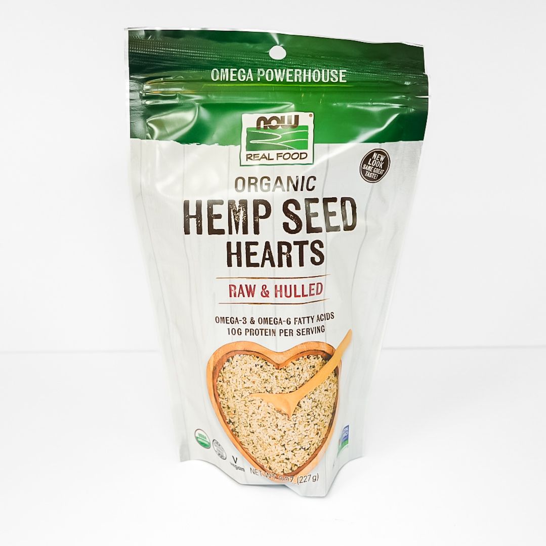 Organic Hemp Seed Hearts bag in green and white packaging with heart-shaped window showing seeds.