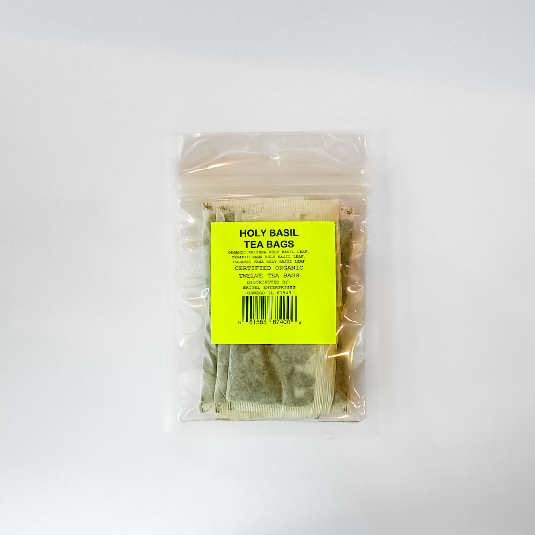 Clear plastic bag of loose herbal tea with a bright yellow label on a white background