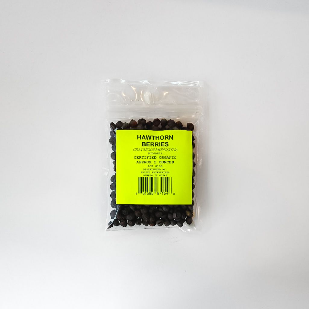 Clear plastic bag of black pellets with a bright yellow label on a white background