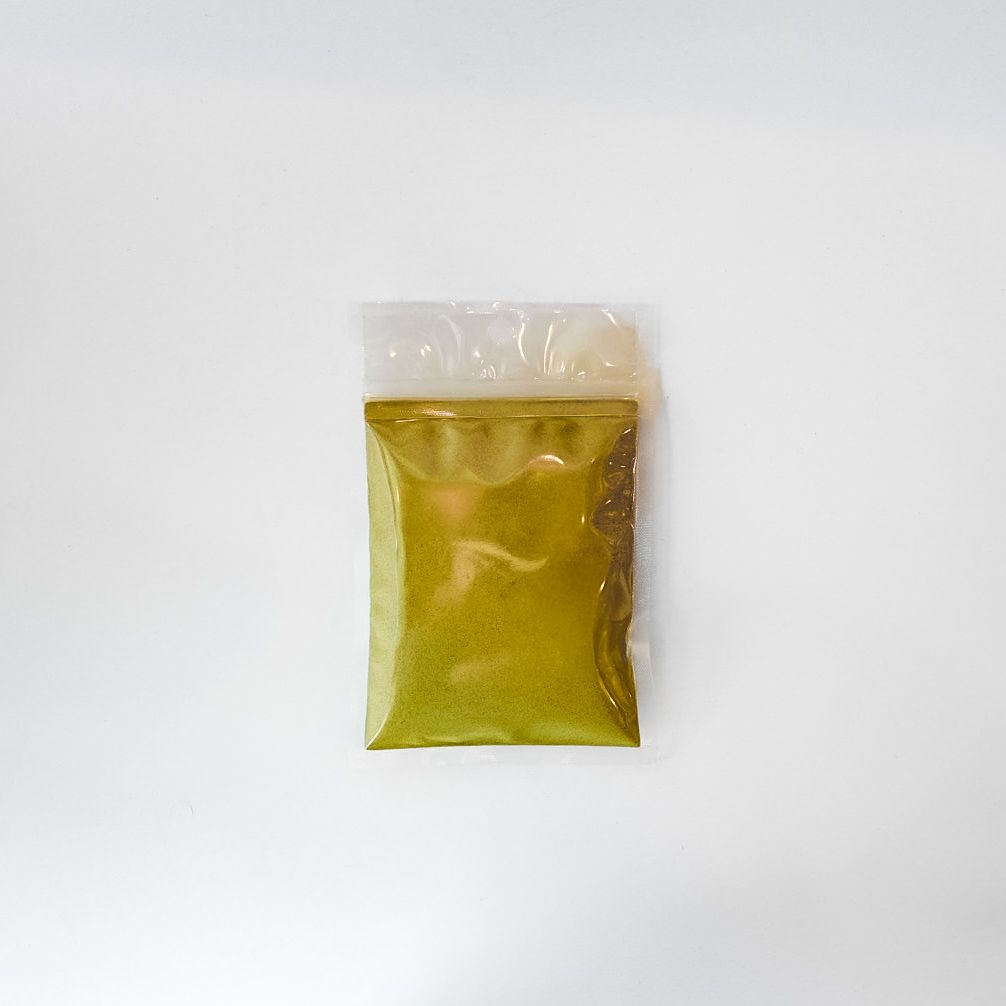 Small clear plastic pouch of horsetail powder with a bright yellow label on a white background