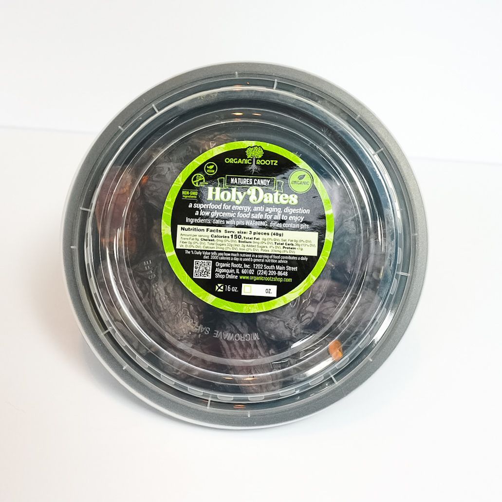 Round black-labeled package of HolyDates snack on a white background