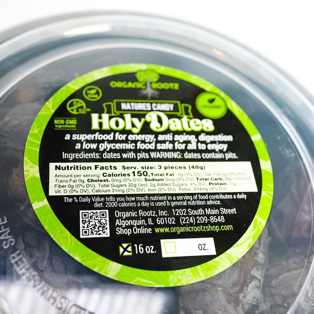 Round black-labeled package of HolyDates snack on a white background
