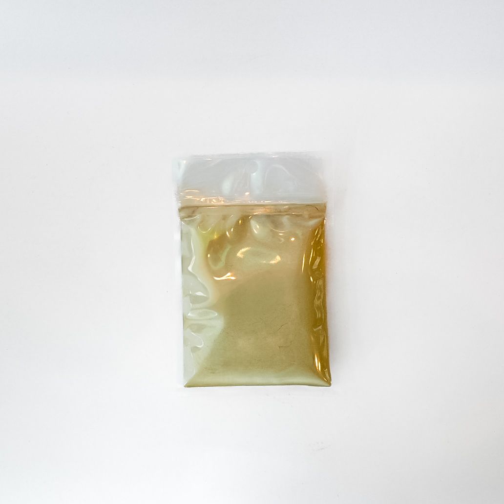 Small clear plastic bag with yellow contents and a bright yellow label/barcode on a white background