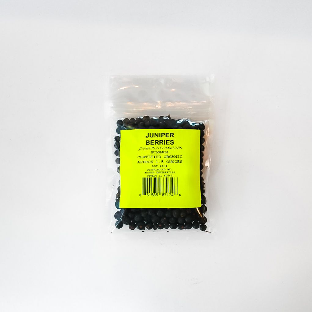 Bag of dried juniper berries with bright yellow label on a white background