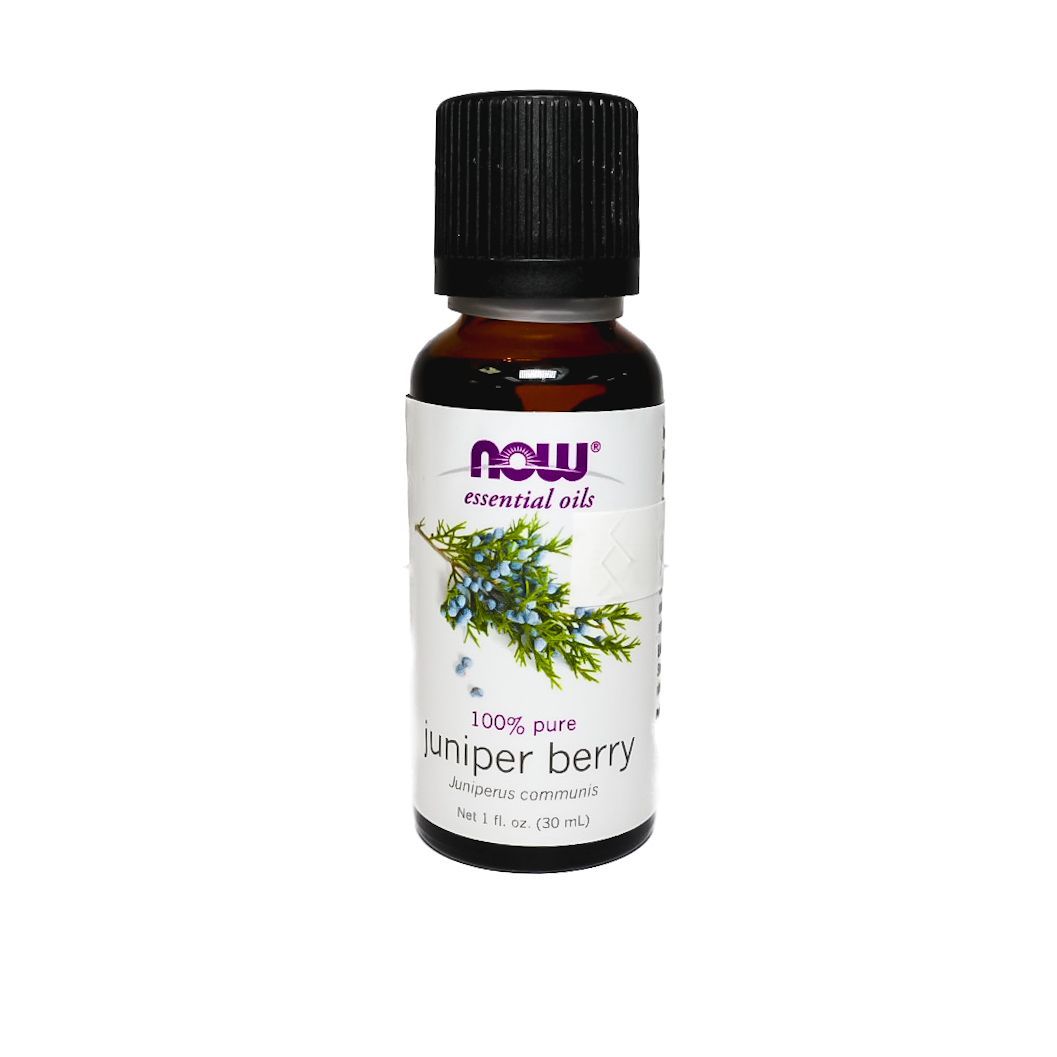 Small brown NOW brand anise berry essential oil bottle with black cap on white background