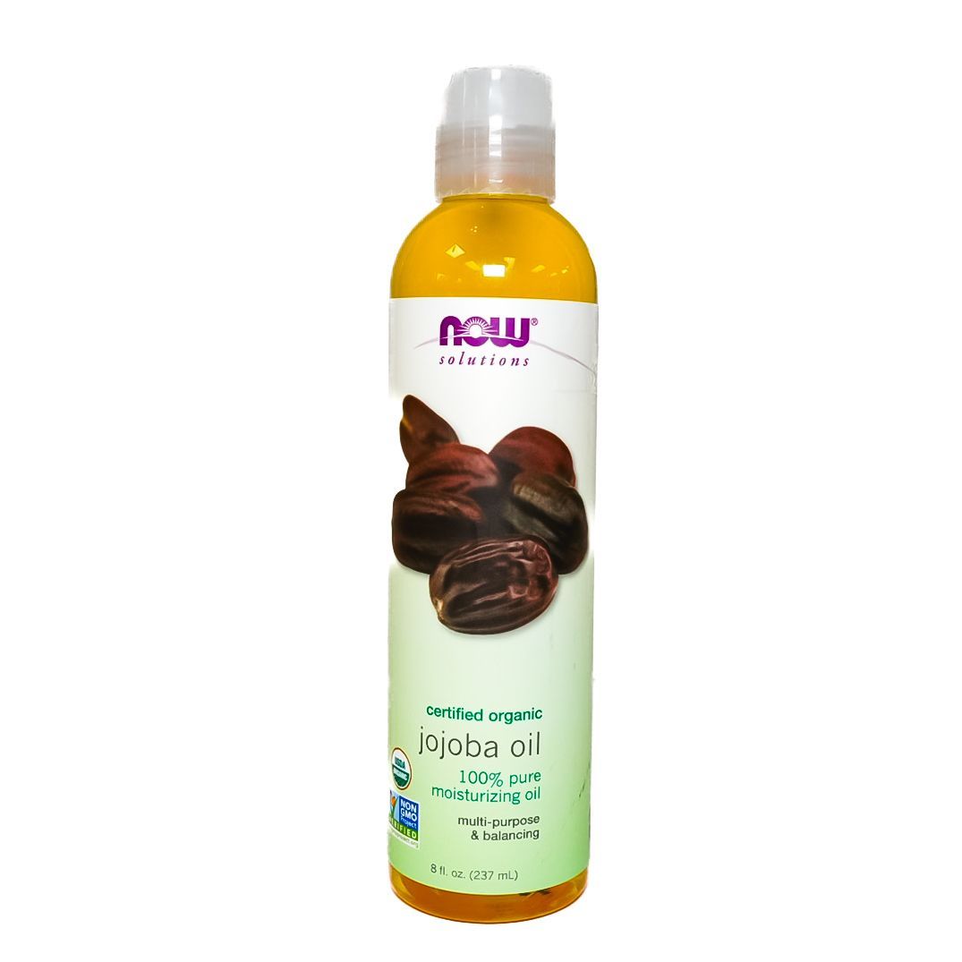 Bottle of NOW Solutions cocoa butter oil with cocoa bean image on the label, white and amber bottle.