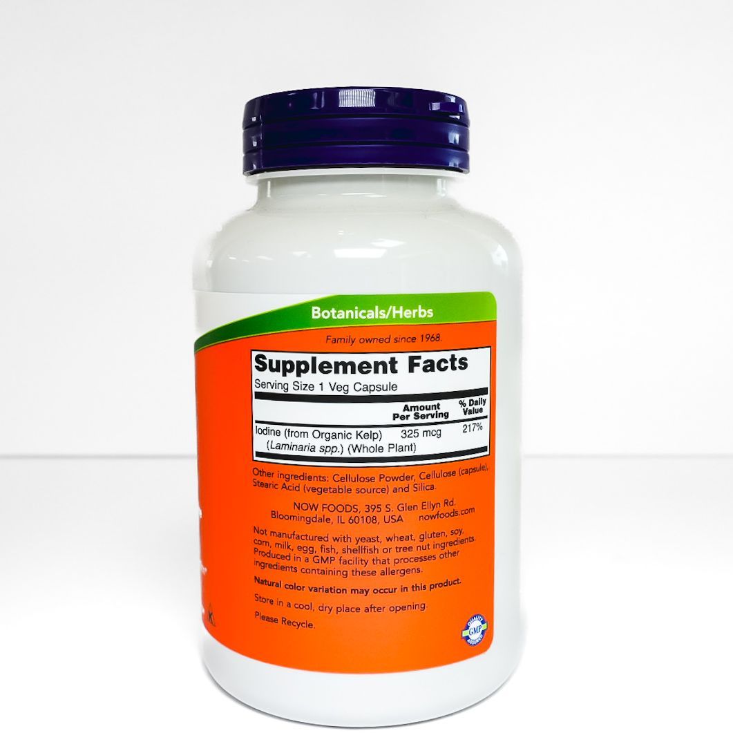 NOW Kelp dietary supplement bottle with white label, orange panel, and dark blue cap