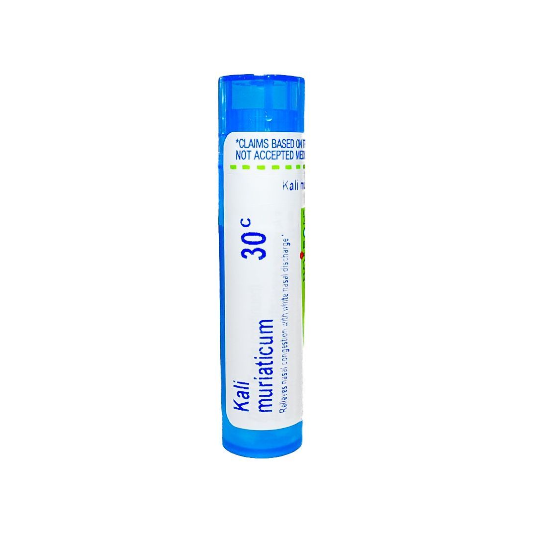 Blue cylindrical homeopathic medicine tube labeled “Kali muriaticum 30C.”