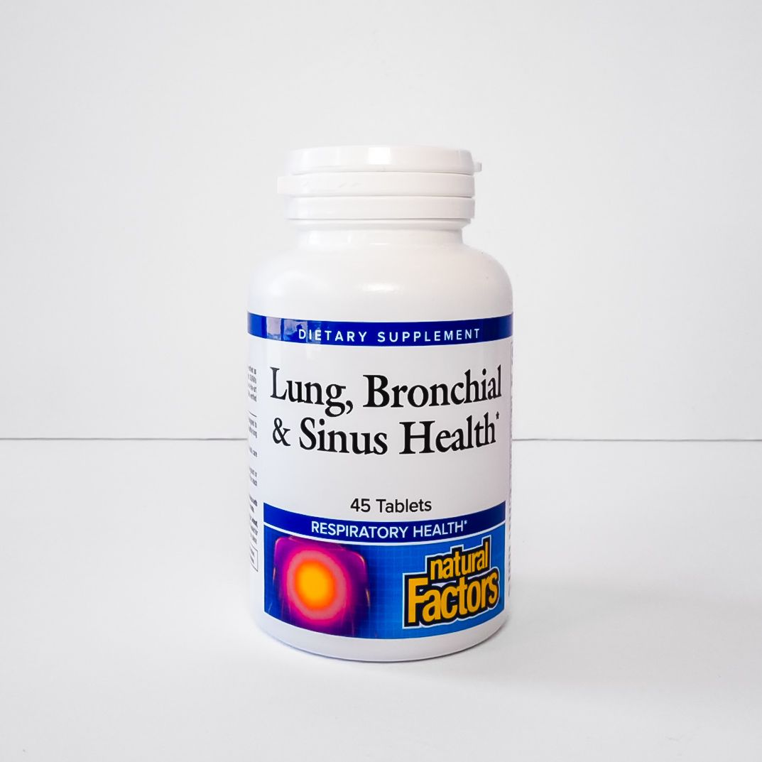 White bottle of lung, bronchial and sinus health supplement with blue label on white background