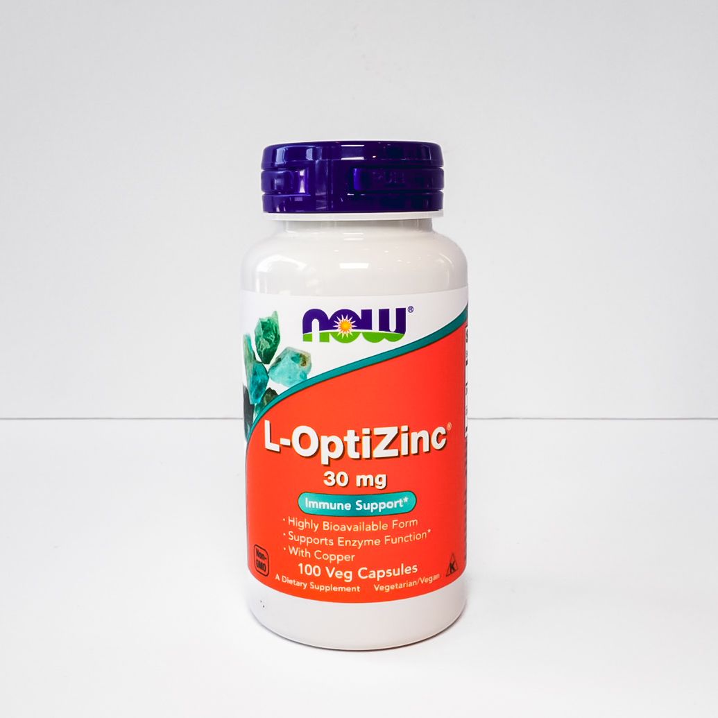 NOW OptiZinc 30 mg supplement bottle with white label and purple cap on a light background