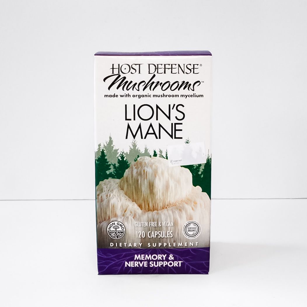 Host Defense Lion's Mane mushroom supplement box, white and purple with forest graphic, memory and nerve support