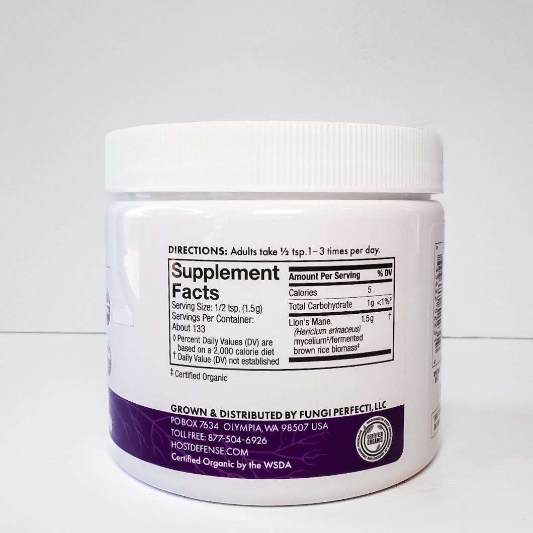 White jar of Host Defense Lion’s Mane mushroom supplement with purple label on a light background