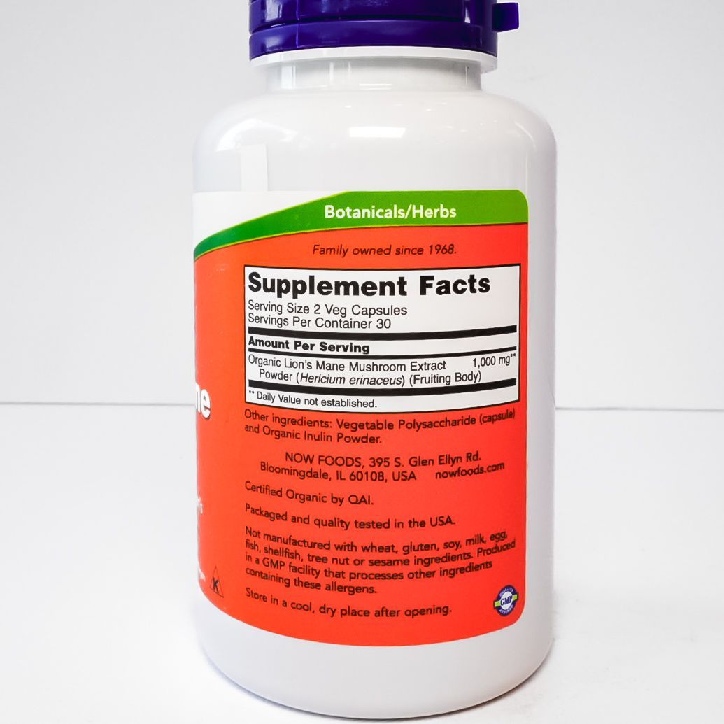 NOW Lion’s Mane 500 mg supplement bottle with white body, red label, and purple cap