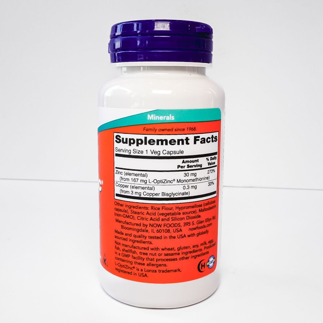 NOW OptiZinc 30 mg supplement bottle with white label and purple cap on a light background