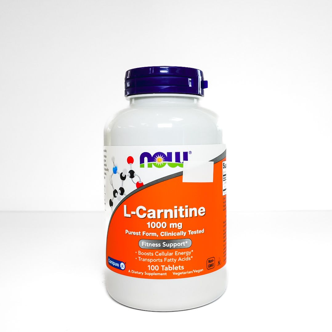 Bottle of L-carnitine supplement with white label and orange front, purple cap on white background