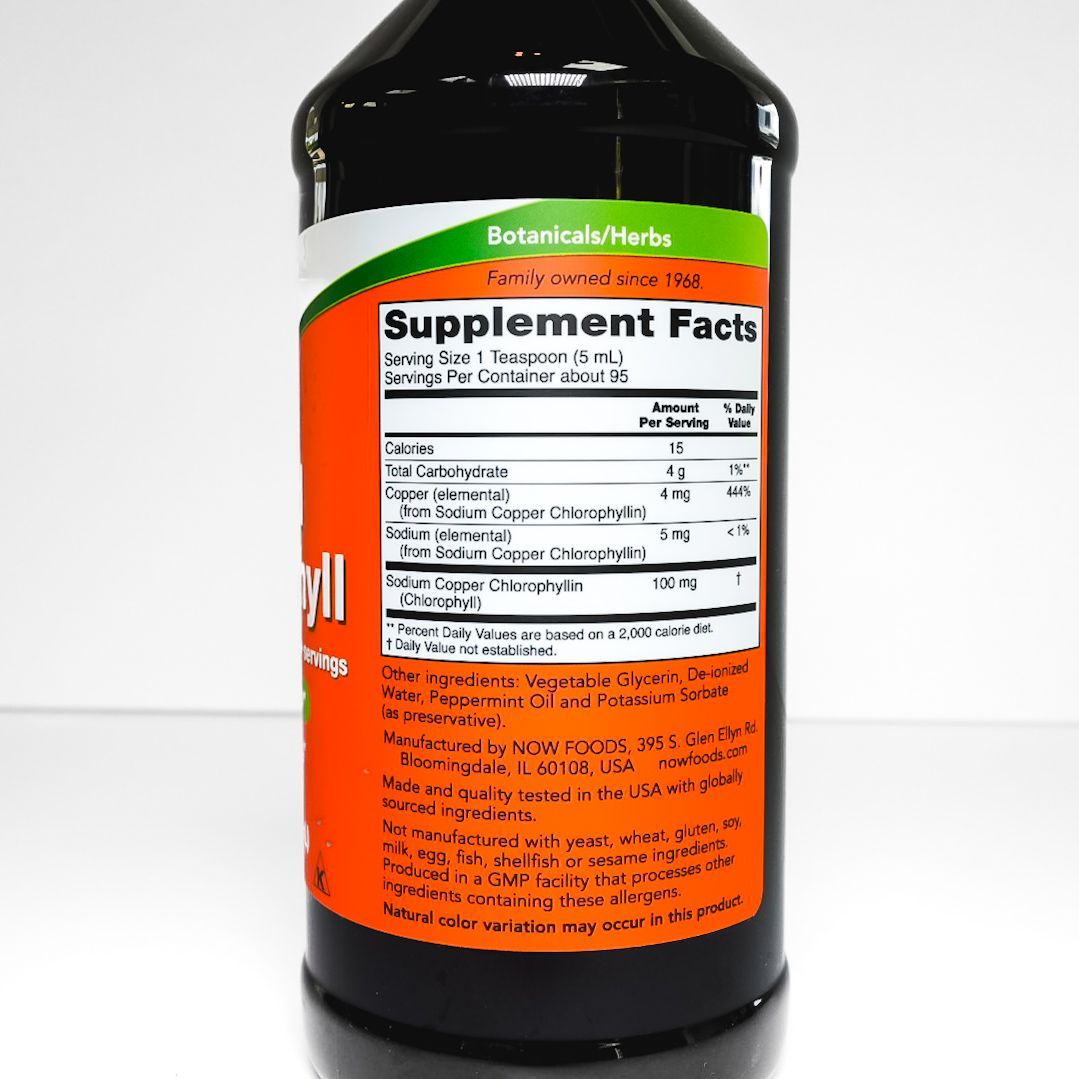 NOW Liquid Chlorophyll supplement bottle with orange label and black cap