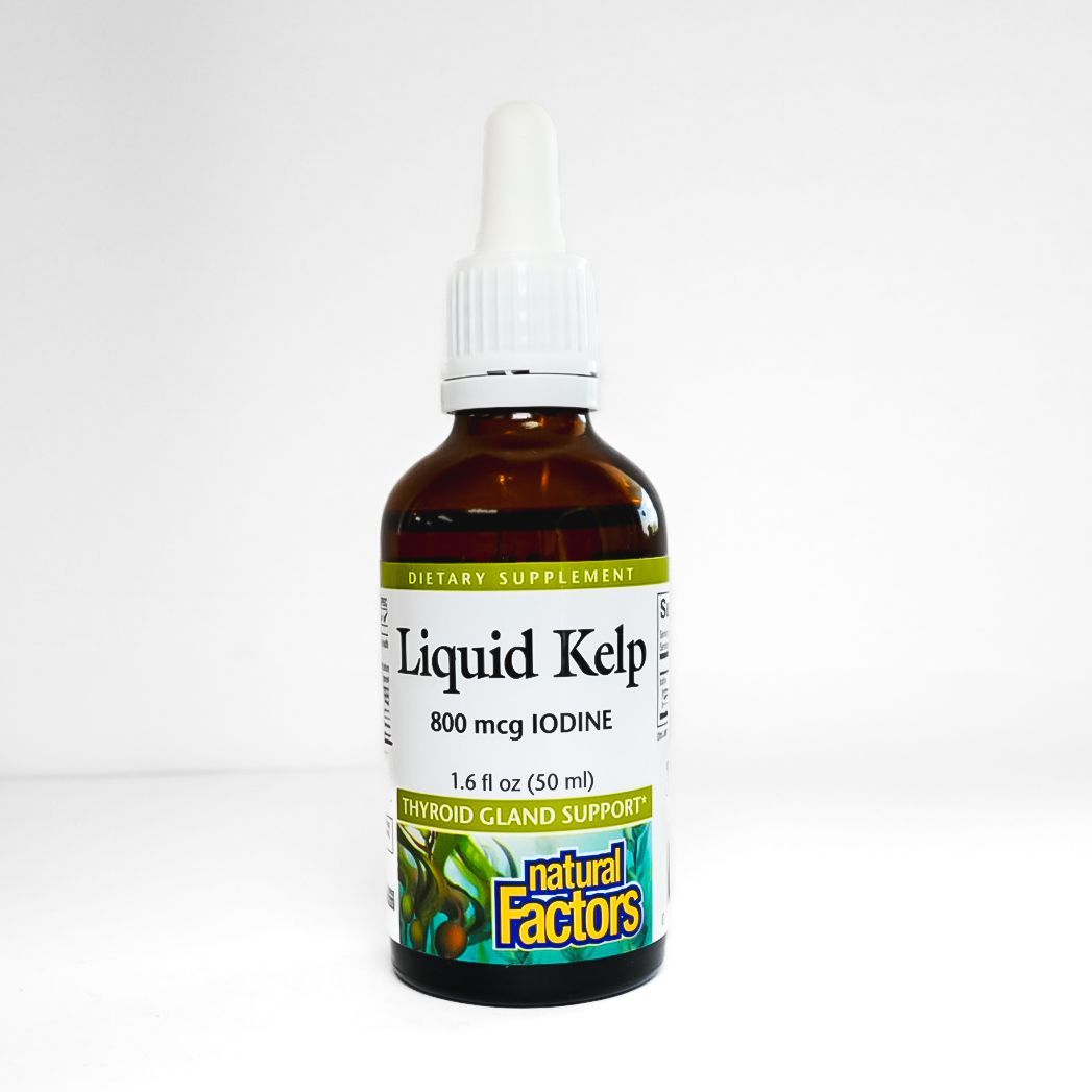Small brown Liquid Kelp supplement bottle with white dropper cap and green label on white background