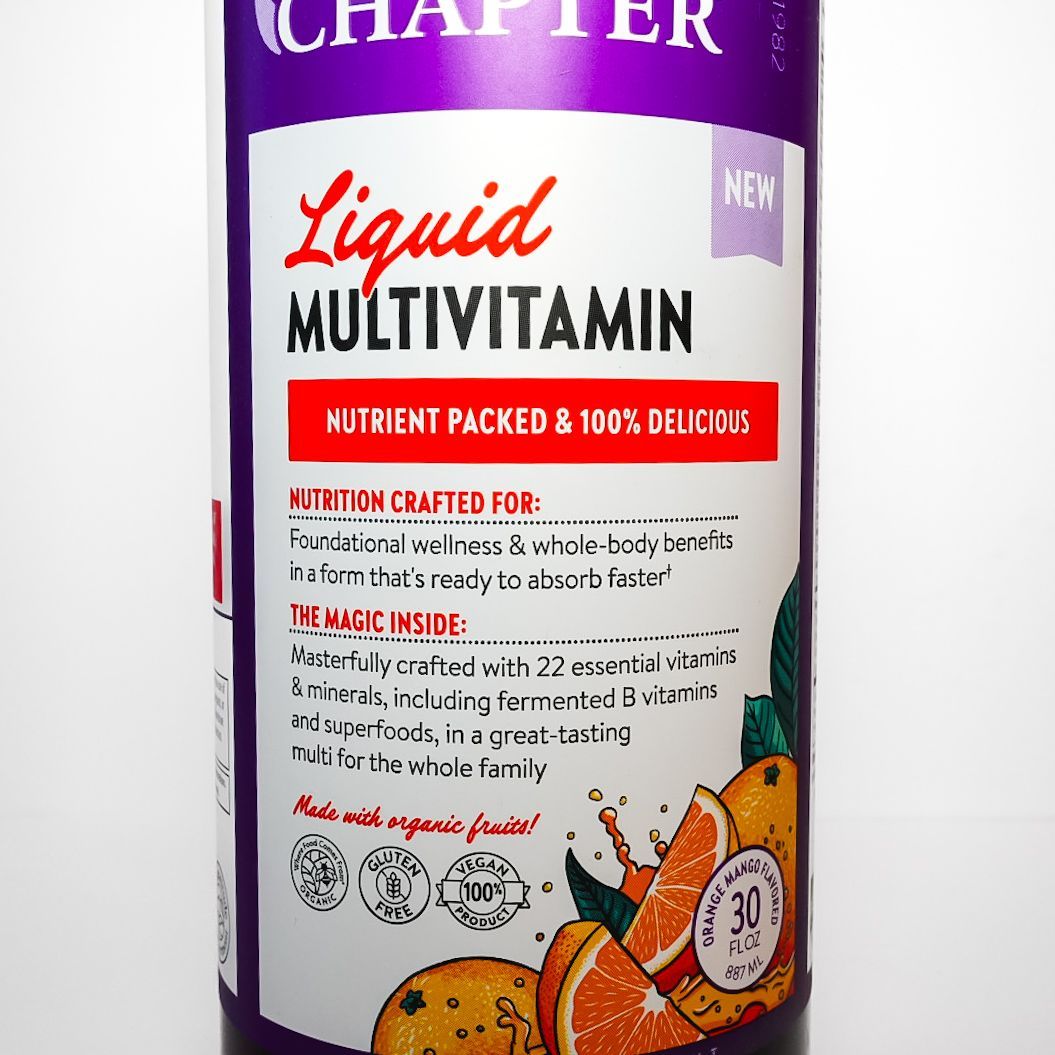 Purple bottle of New Chapter Liquid Multivitamin with white label and orange fruit illustration