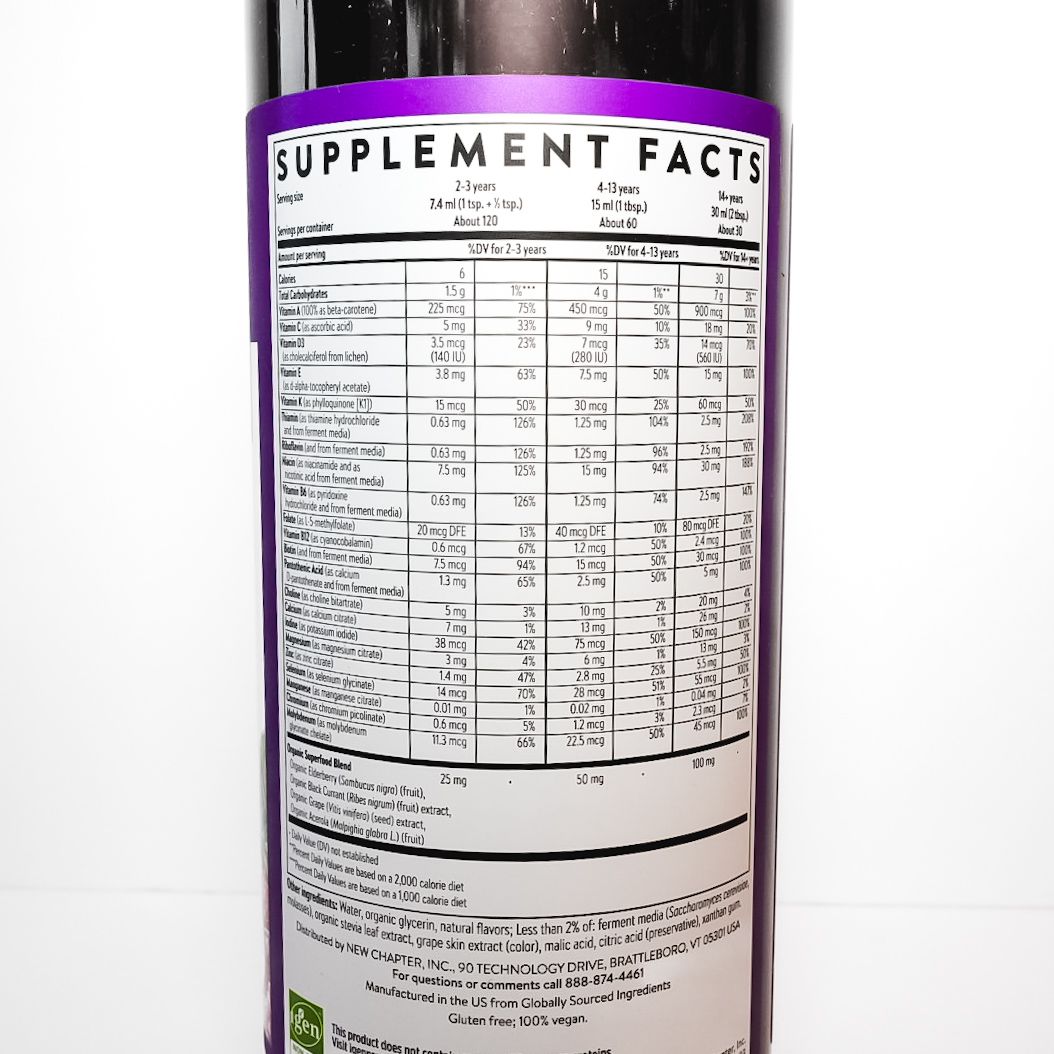 Black bottle of New Chapter Liquid Multivitamin with purple cap and label on a white background