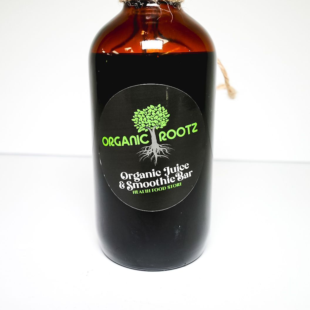 Brown dropper bottle with black label reading “Organic Roots” on a white background