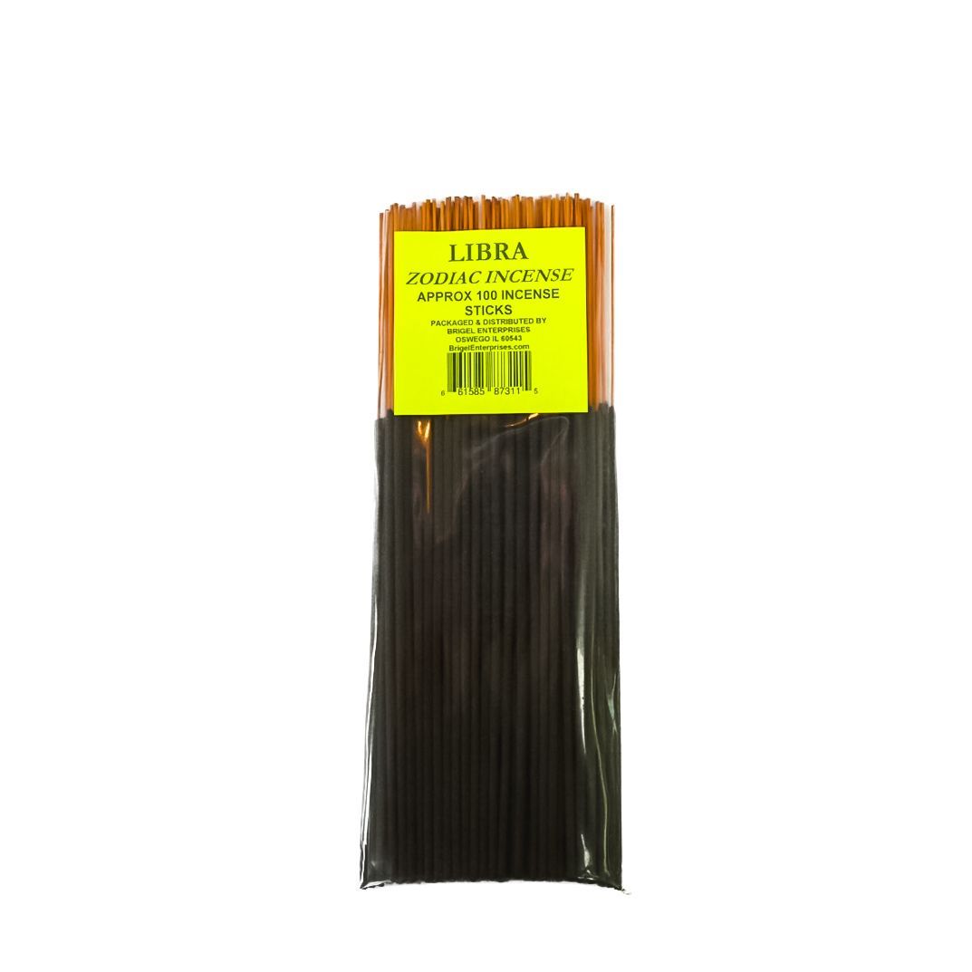 Bundle of black incense sticks with a yellow label on a white background