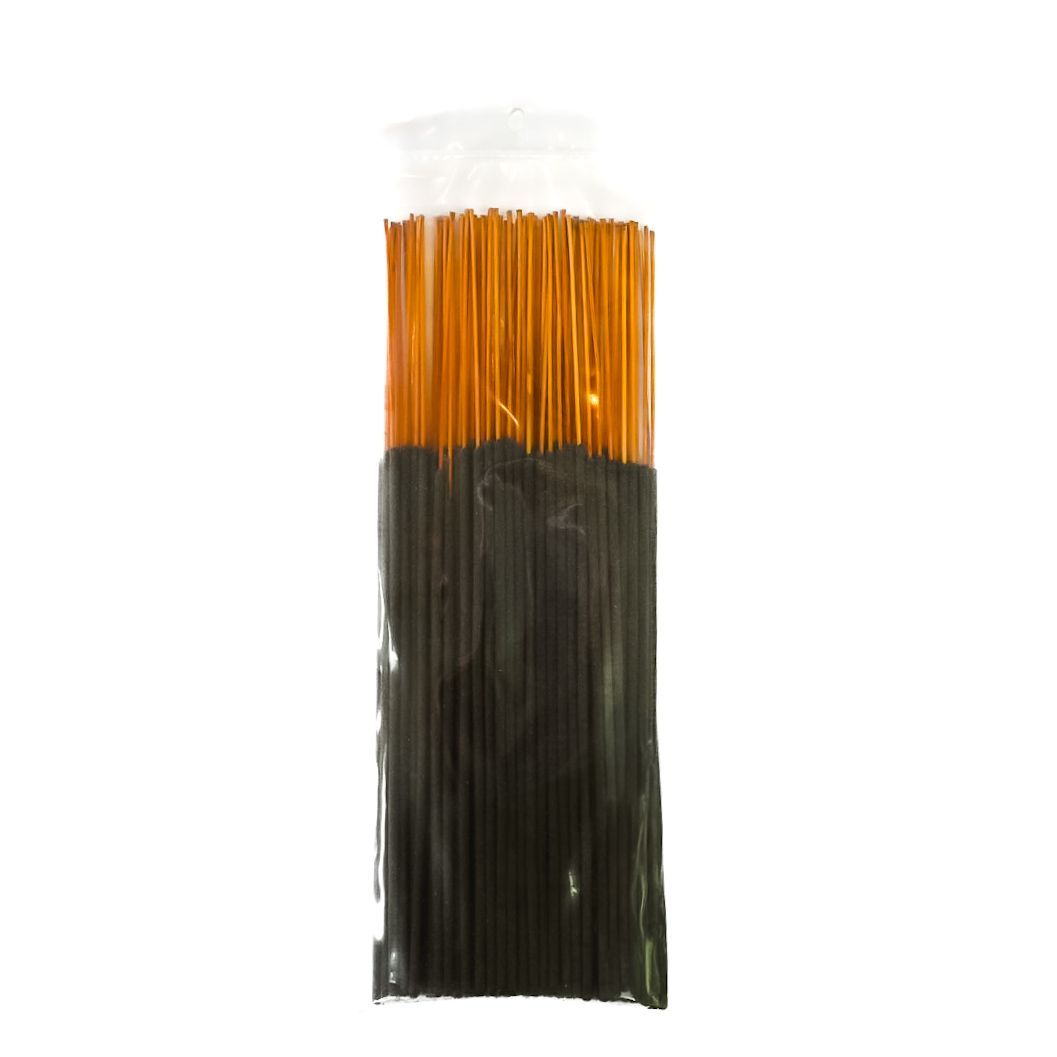 Bundle of black incense sticks with a yellow label on a white background