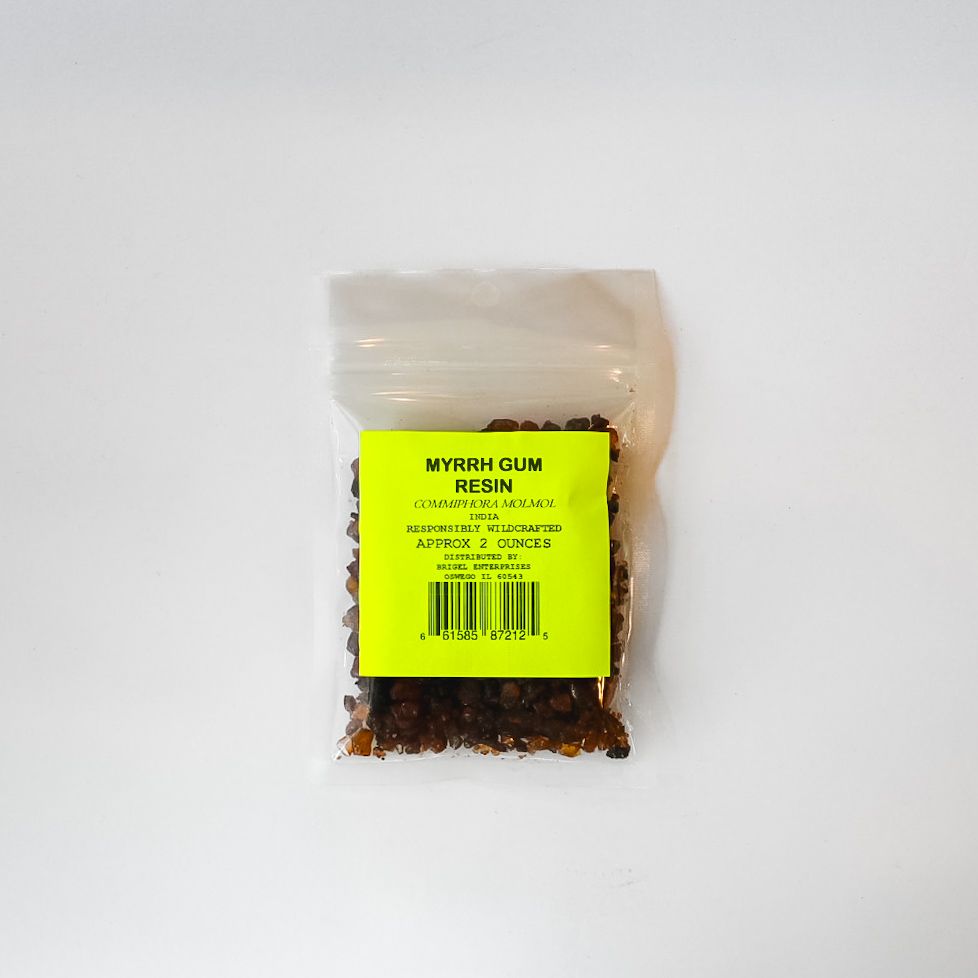 Small clear plastic bag of dried herbs with a bright yellow label on a white background