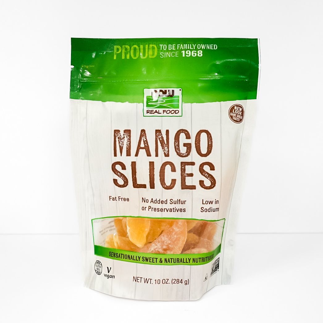 Green-and-white pouch of mango slices with large brown “MANGO SLICES” text on the front