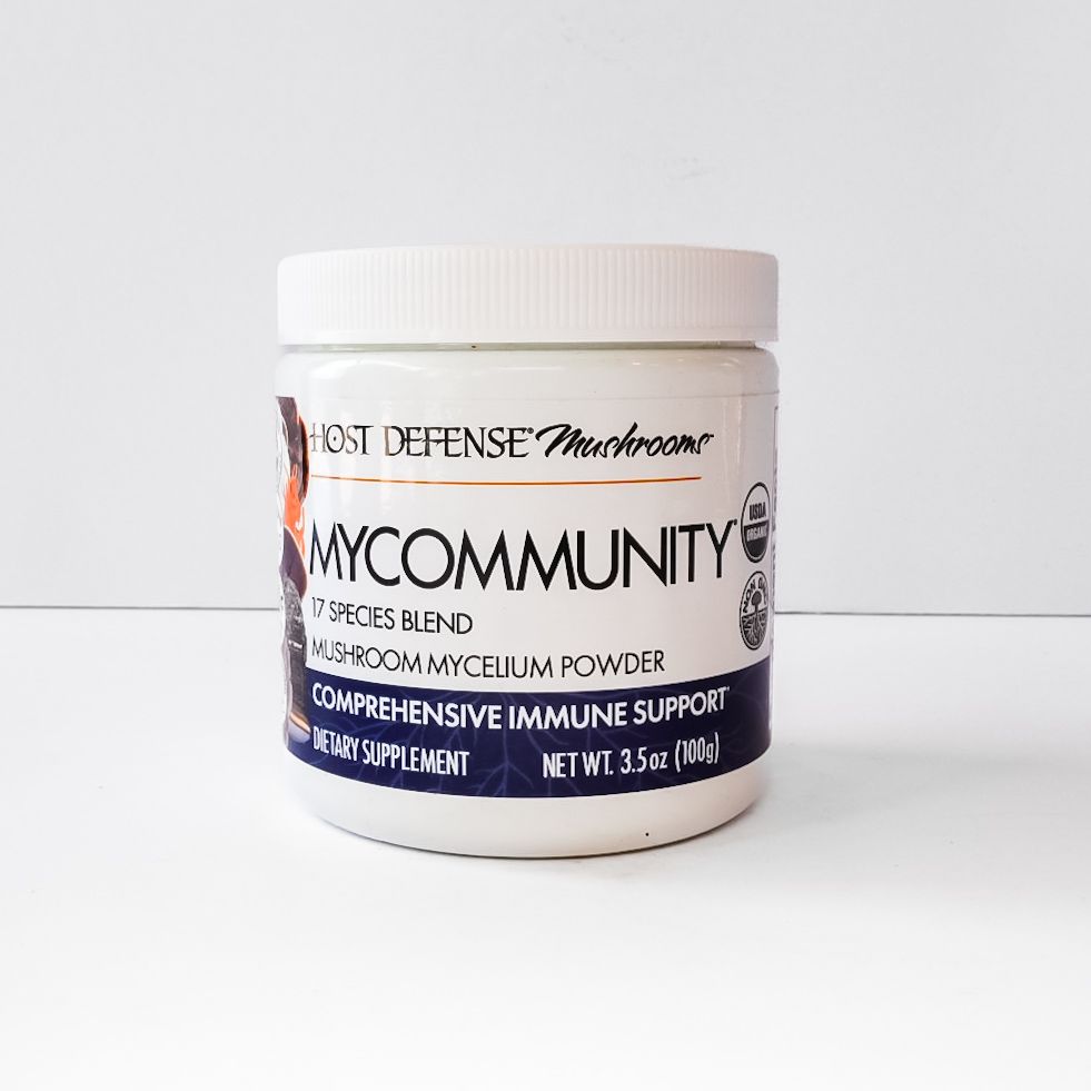White supplement jar labeled “MyCommunity” by Host Defense on a white background