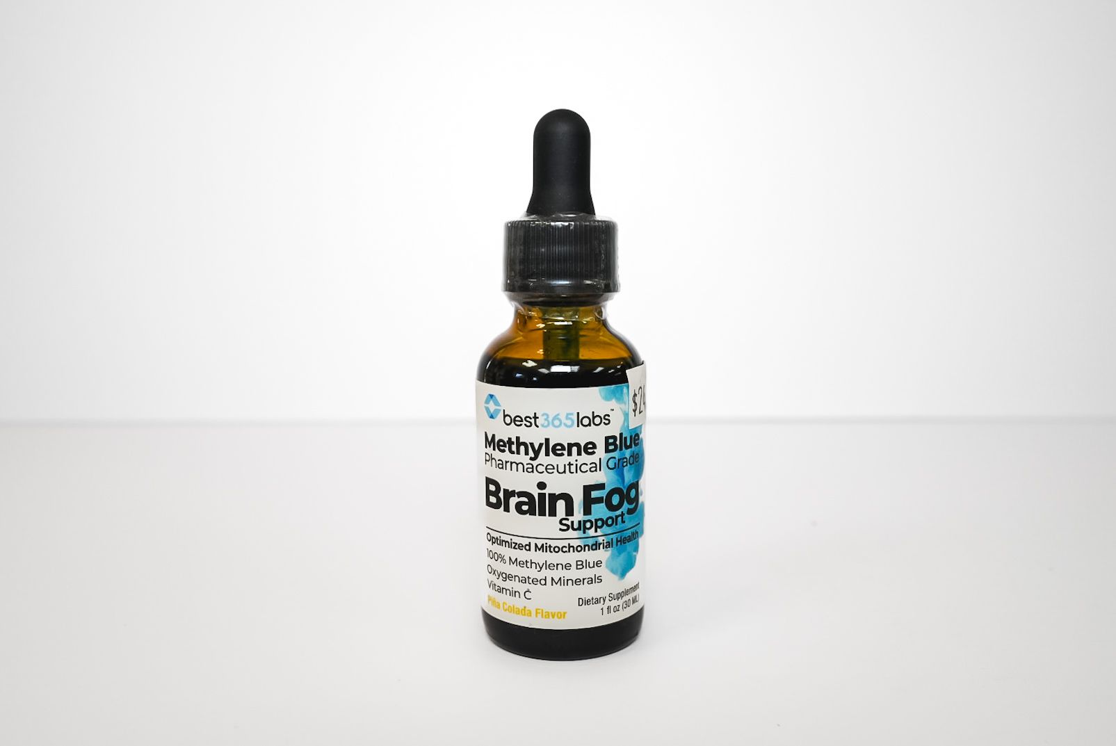 Small amber dropper bottle labeled “Brain Fog” on a white background