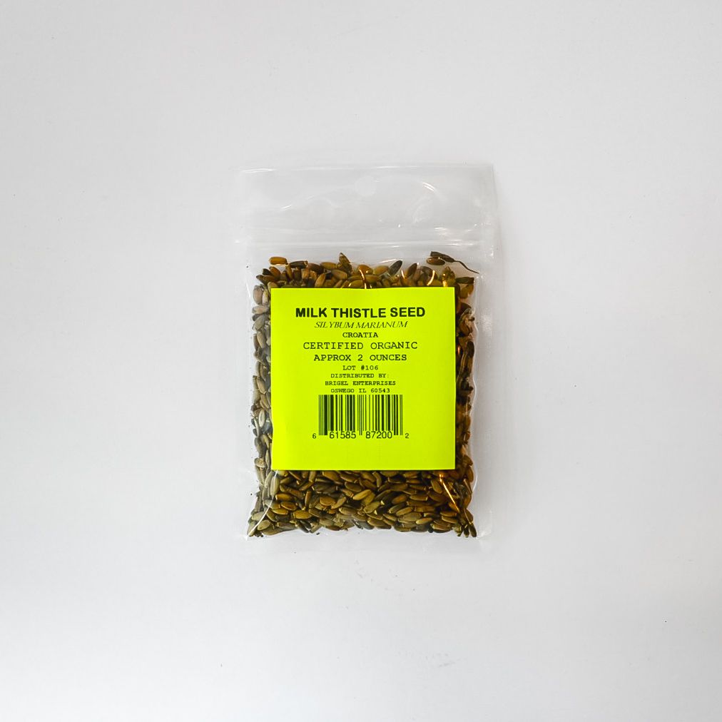 Clear plastic bag of yellow and brown milk thistle seeds with bright yellow label on a white background