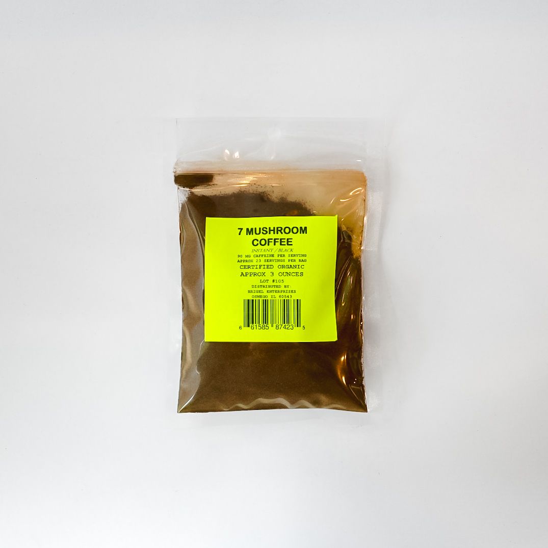 Clear plastic bag of brown powder with a bright yellow label on a white background