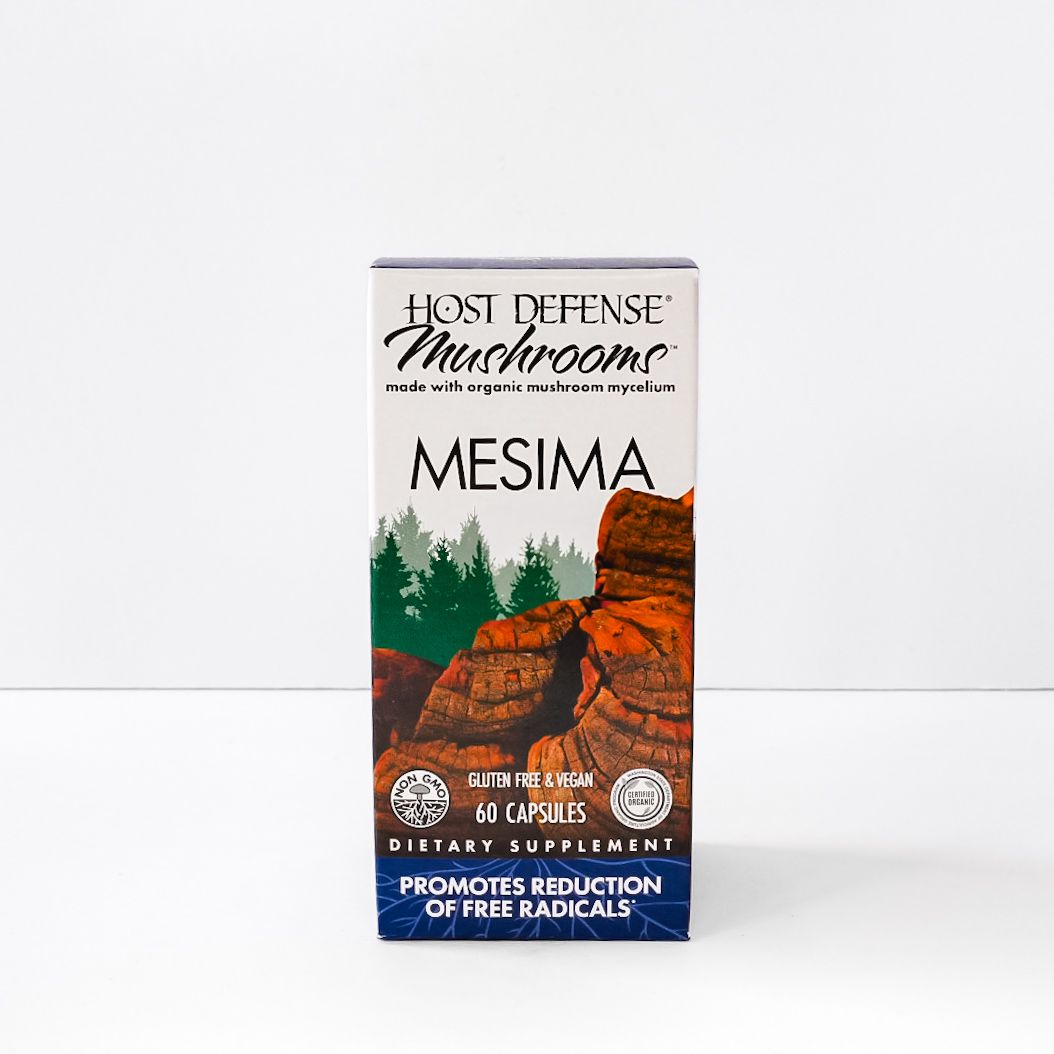 Mushroom supplement box labeled “MESIMA” with red-orange mushrooms and green forest graphic