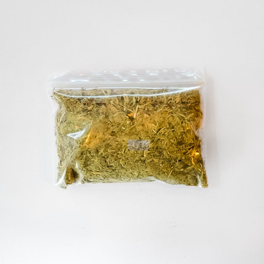 Clear plastic bag of dried marshmallow root with a bright yellow label on a white background