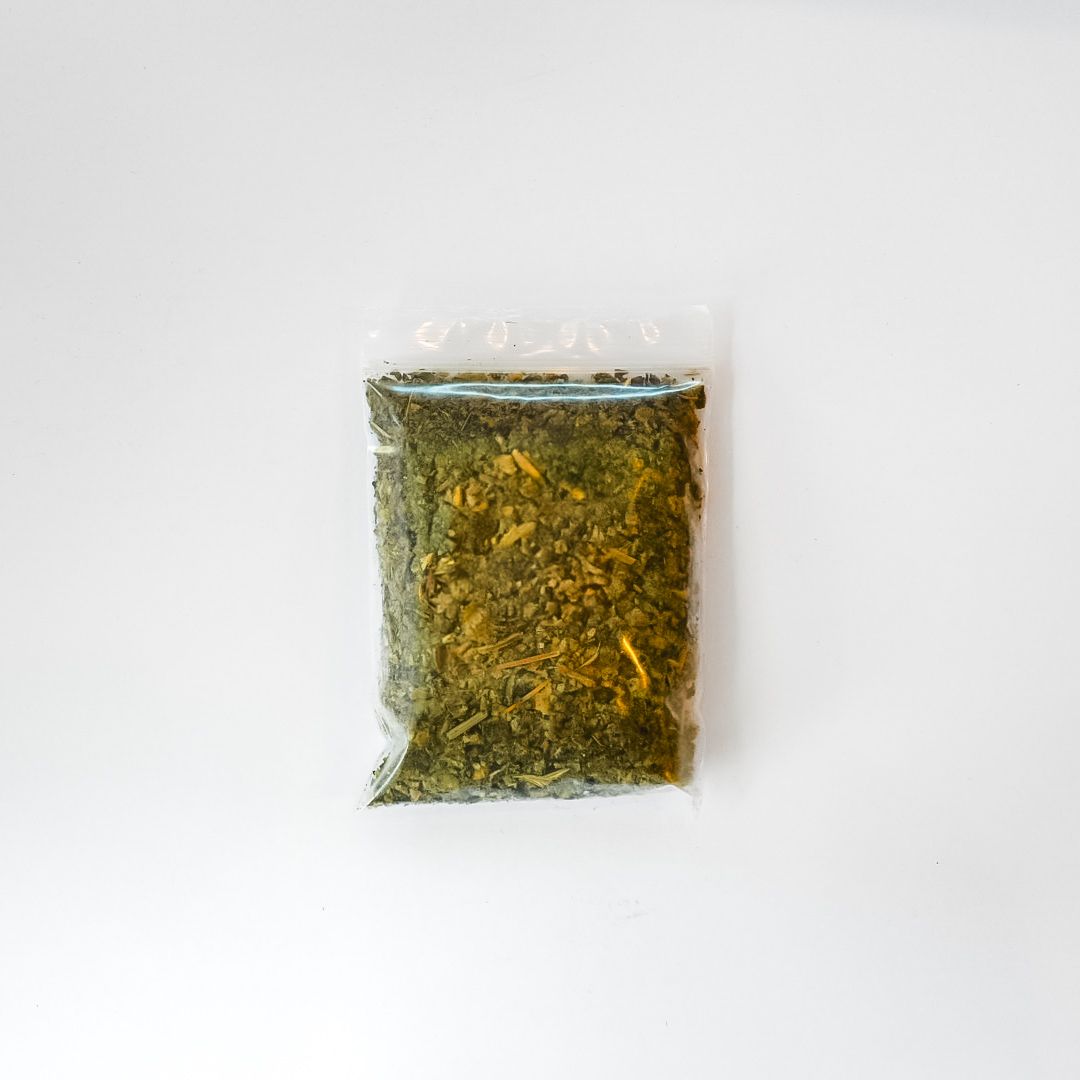 Small clear bag of dried mullein leaf with a bright yellow label on a white background