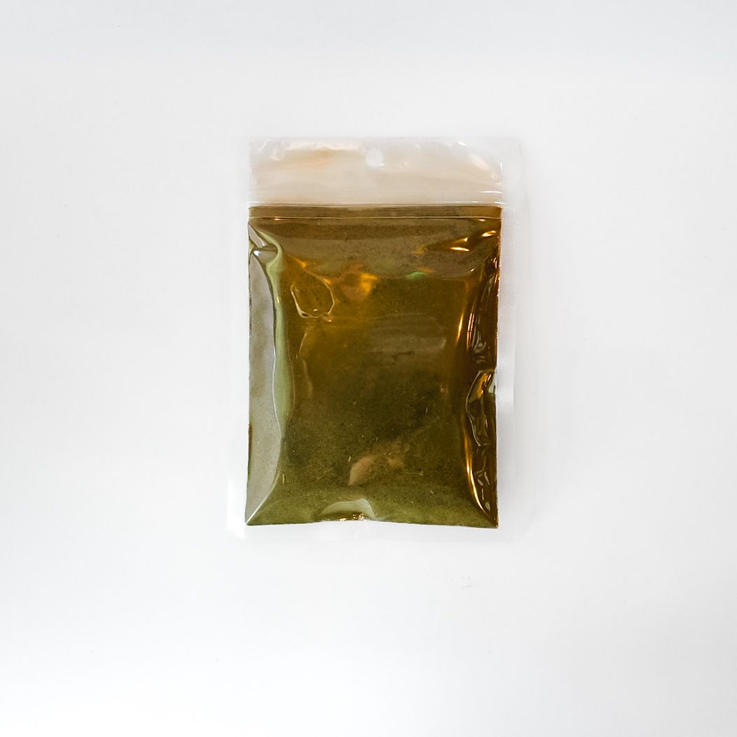 Clear bag of dried mullein leaf powder with a bright yellow label on a white background