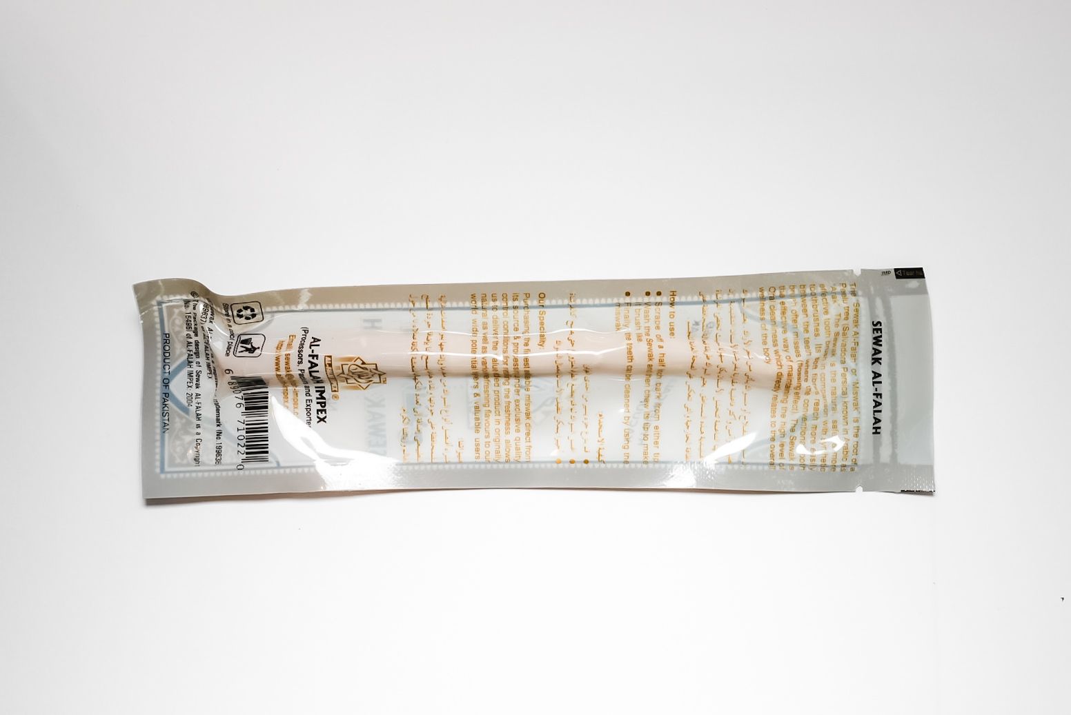 Gold-wrapped snack bar with white center on a plain white background