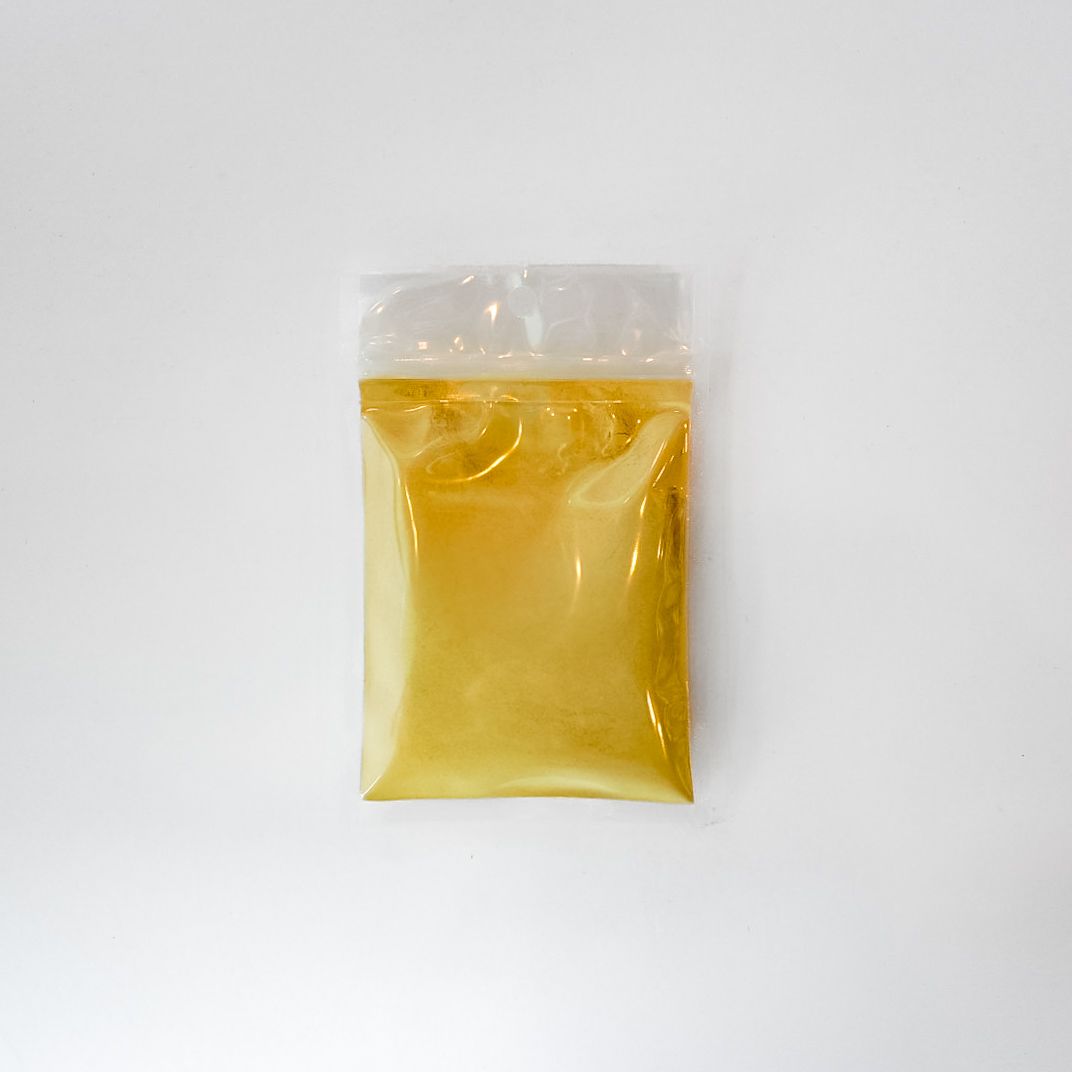 Yellow packet of maca powder with a bright green label on a white background