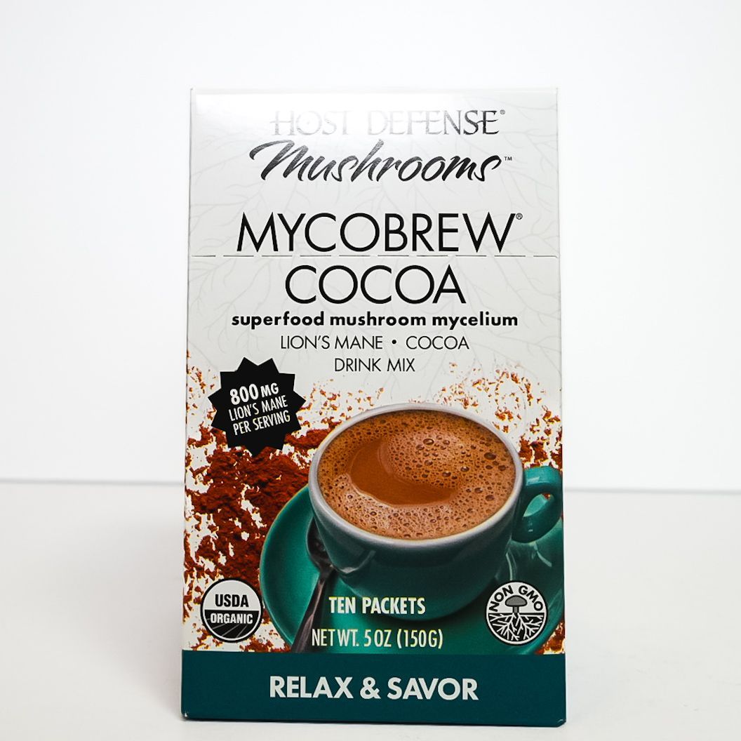 Herbal Defense Mushrooms MycoBrew Cocoa drink mix box with a mug of hot cocoa and mushrooms.