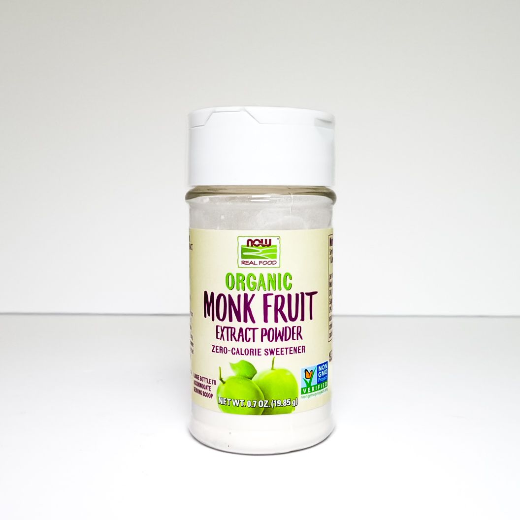 White jar of organic monk fruit extract powder on a light background